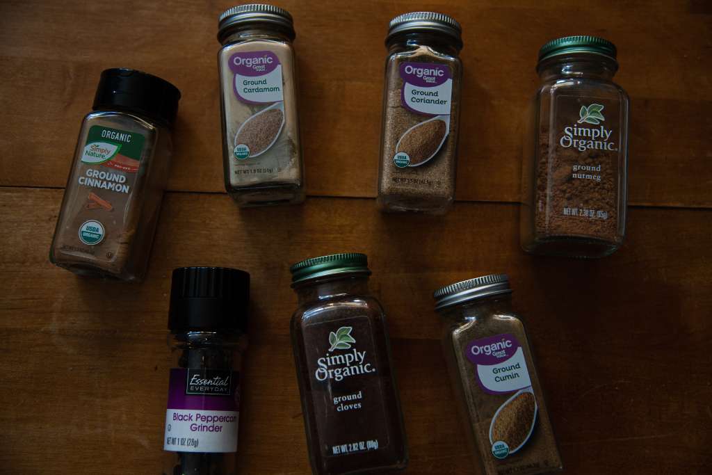 bottles of different spices laying on a table