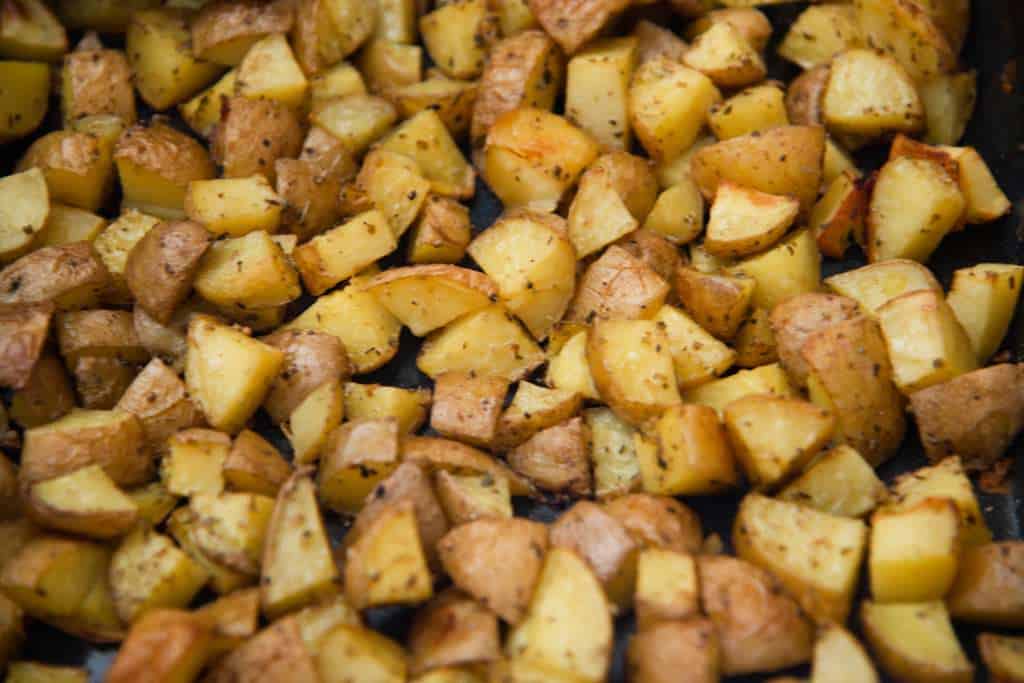 a close up of roasted potaotes
