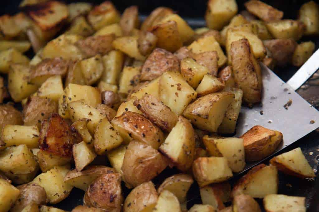 a close up of a spatula of potatoes 
