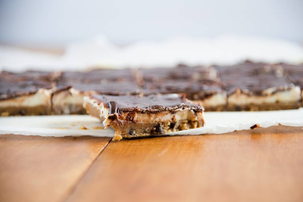 a no-bake cheesecake bar in front of the rest of the sliced bars