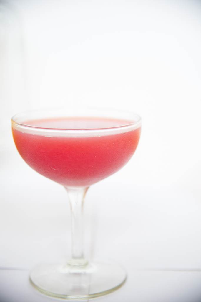 a close up of a finished pink cocktail 