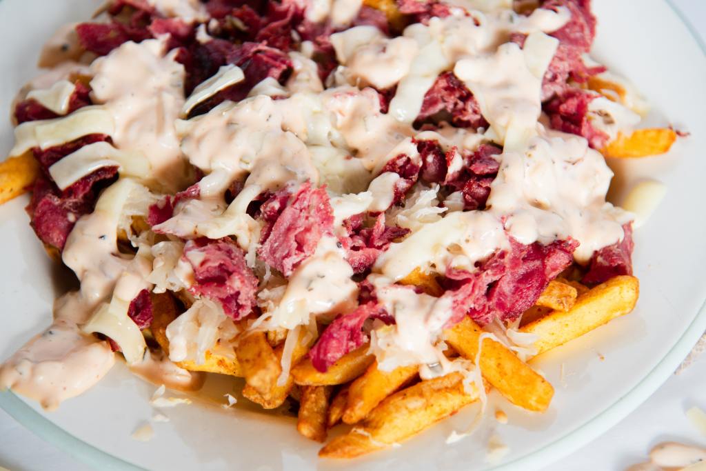 a plate of finished reuben french fries