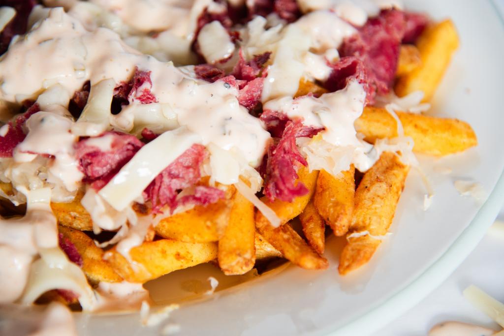 a close up of a plate of finished fries