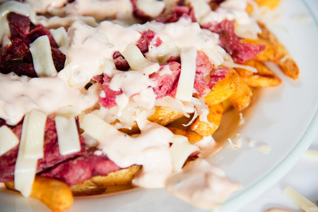 a plate of finished loaded fries 