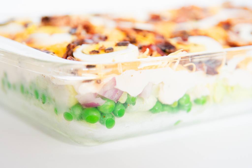 a class cake pan of layered salad