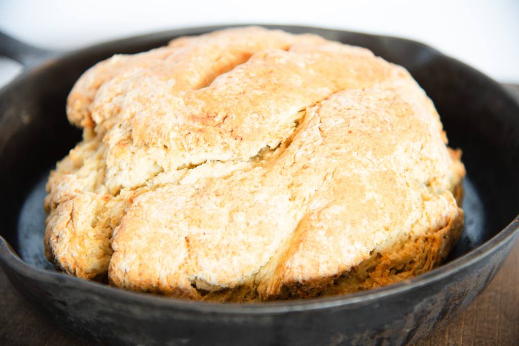 a loaf of soda bread in a cast iron skillet