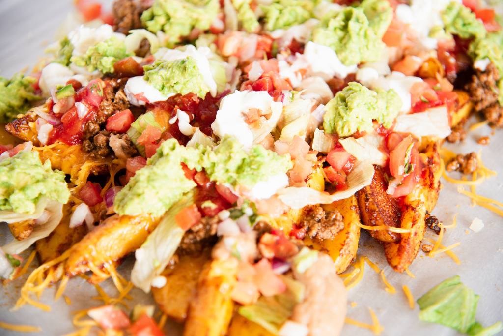 a pan of loaded nacho fries