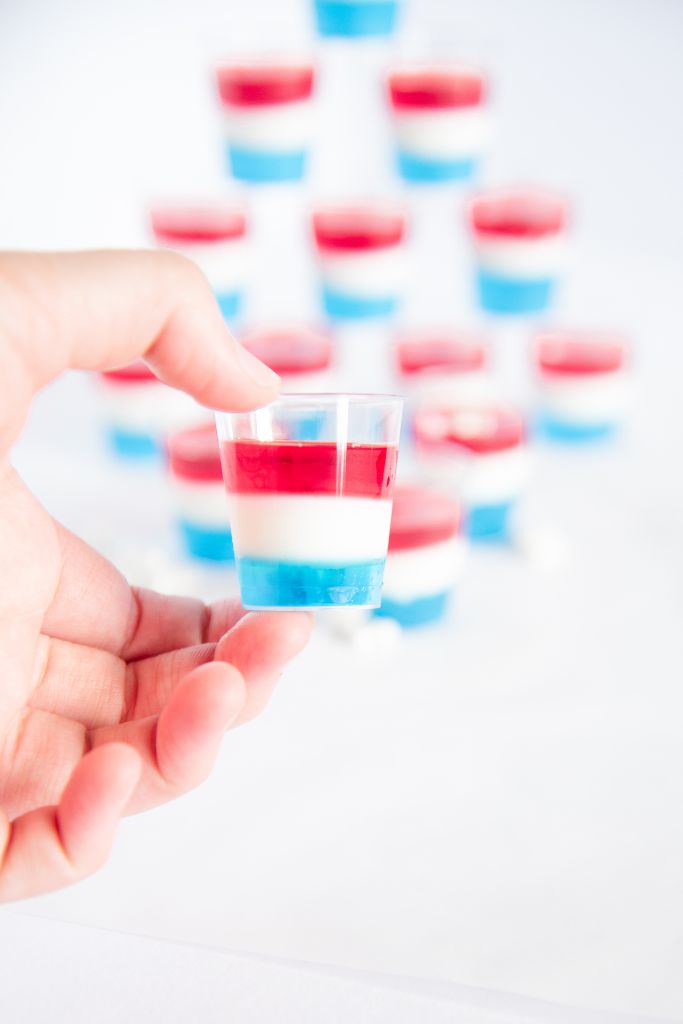 a close up of a jello shot someone is holding 