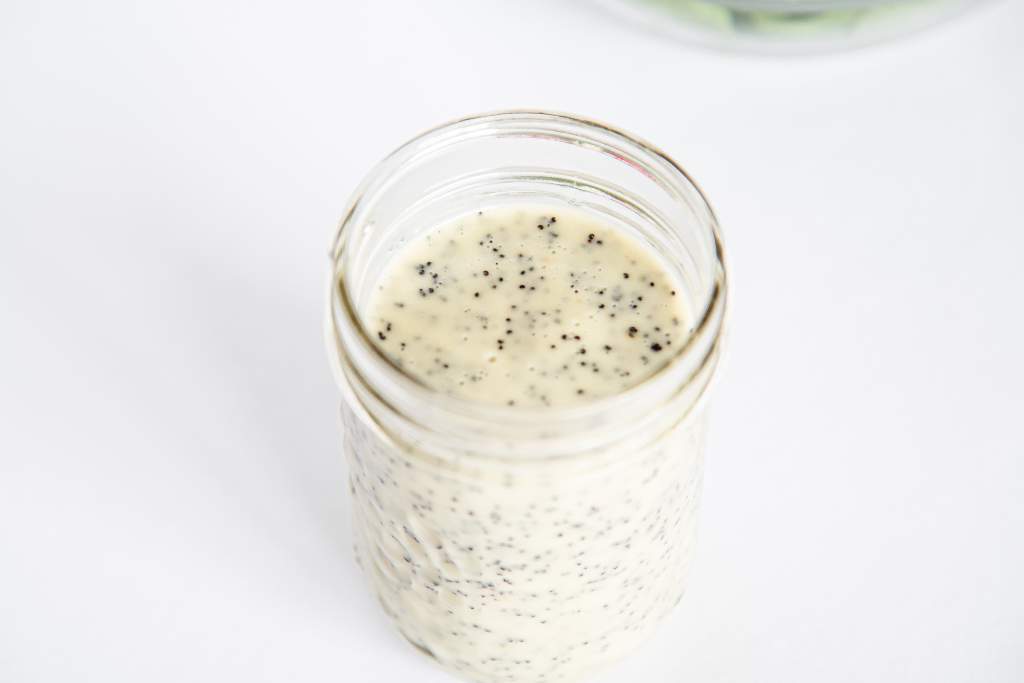 overhead close up of a jar of poppy seed dressing 