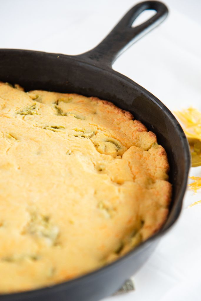 uncut cornbread in a cast iron skillet