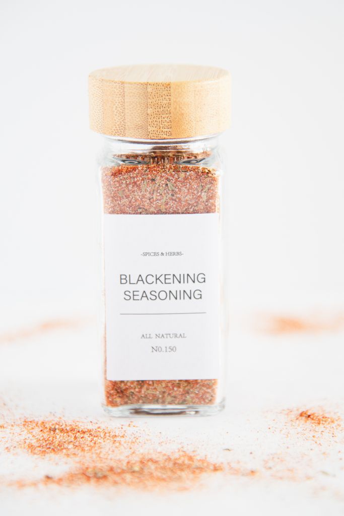 a blackening seasoning in a spice bottle with a wooden cover and label 