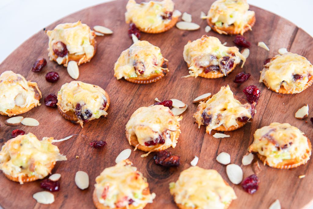 a wooden tray of chicken bites