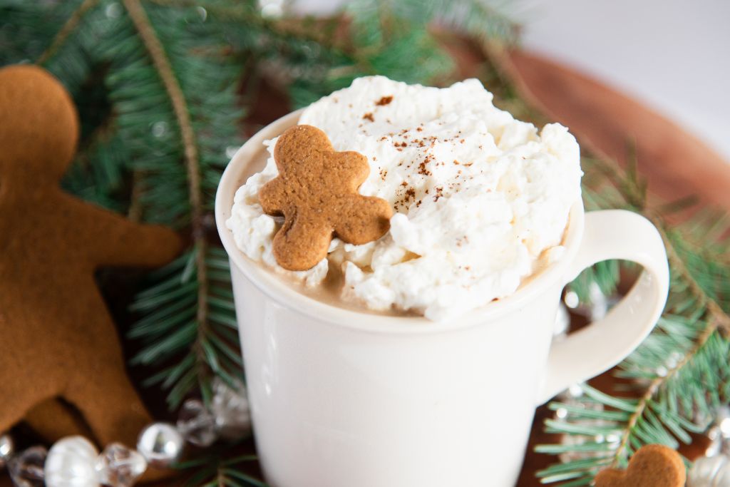 a gingerbread latte with a gingerbread cookies on top