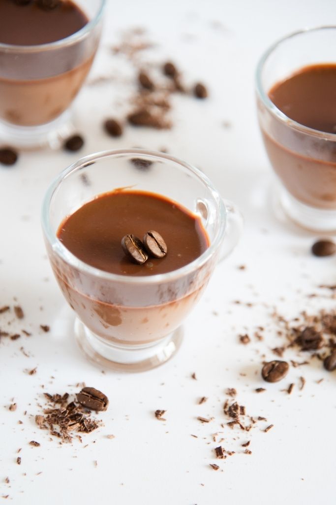 a finished shot with two coffee beans in it 