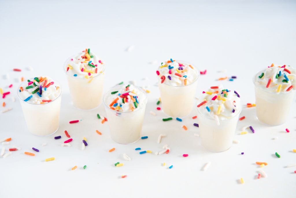 birthday cake shots with sprinkles around them