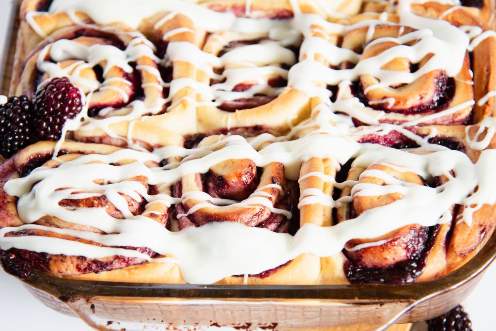 a close up of a pan of sweet rolls