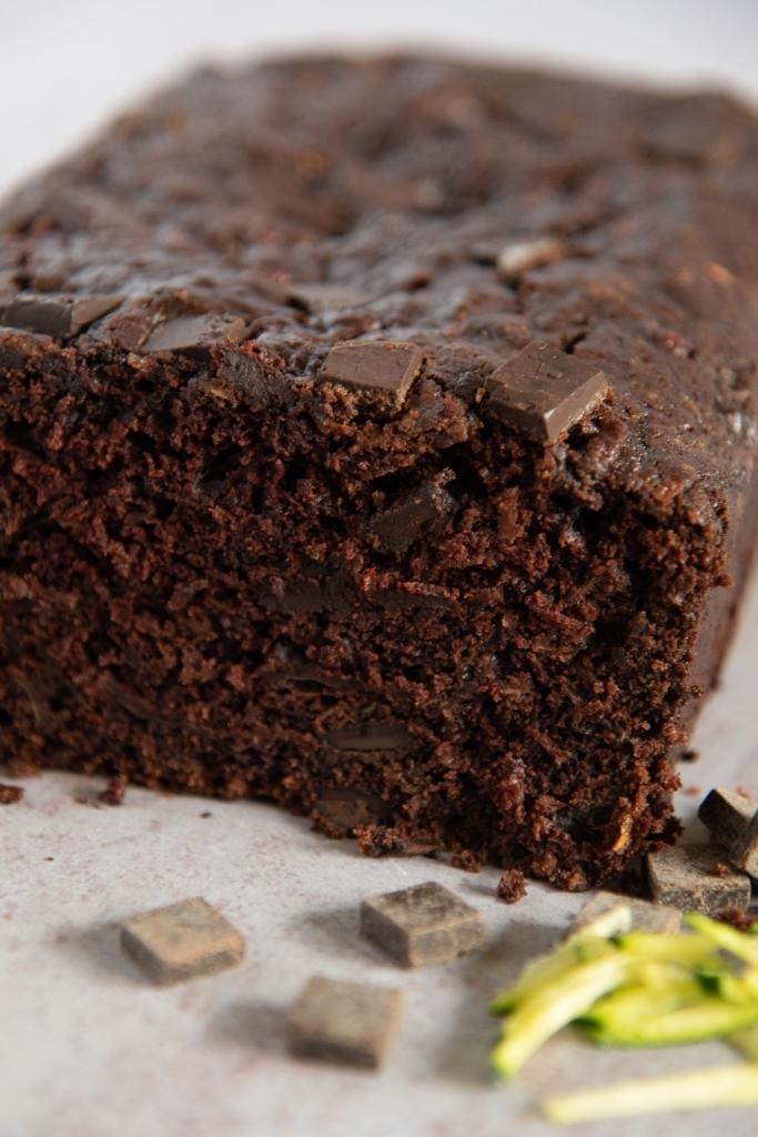 a close up of a cut loaf of chocolate zucchini bread