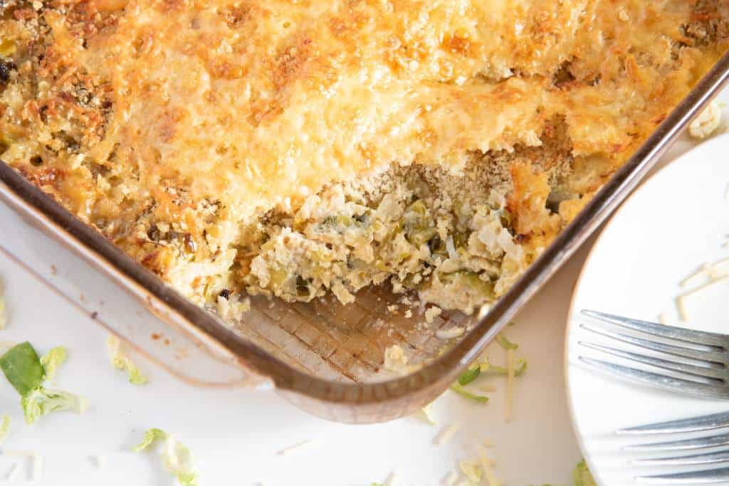 a pan of gratin that has a scoop taken out of it 