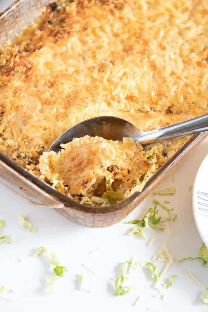 a pan of gratin with a spoon in it 