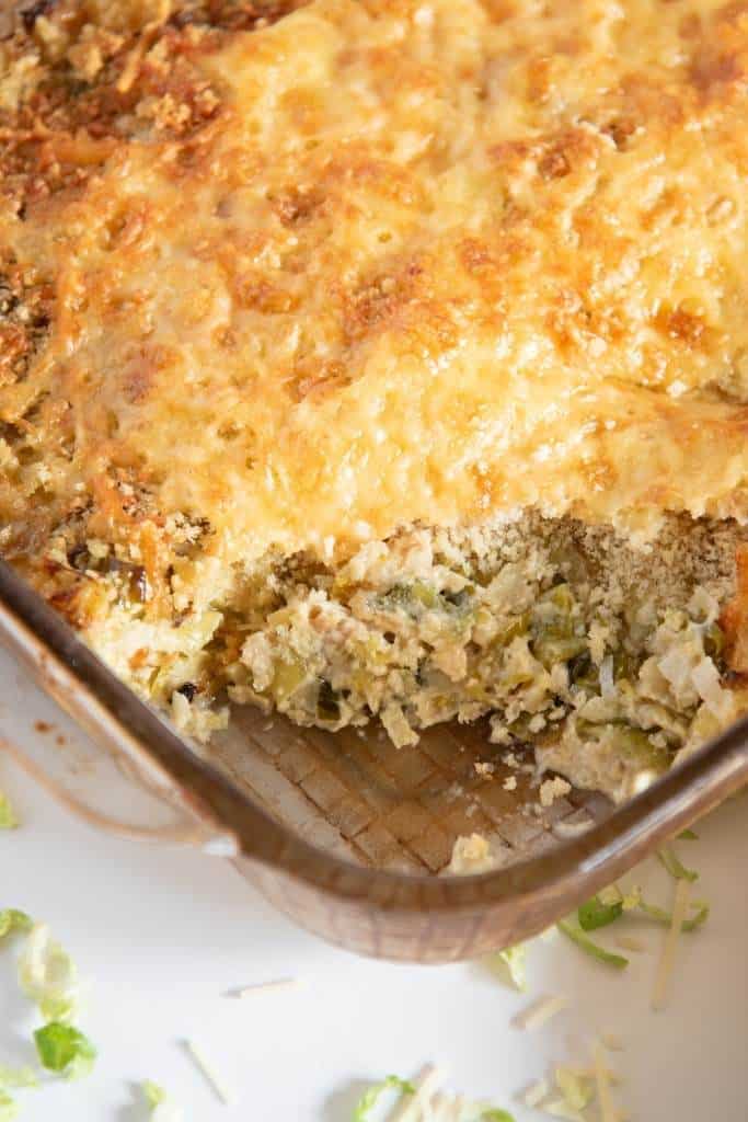 a close up of a pan of gratin that has a scoop taken out of it 