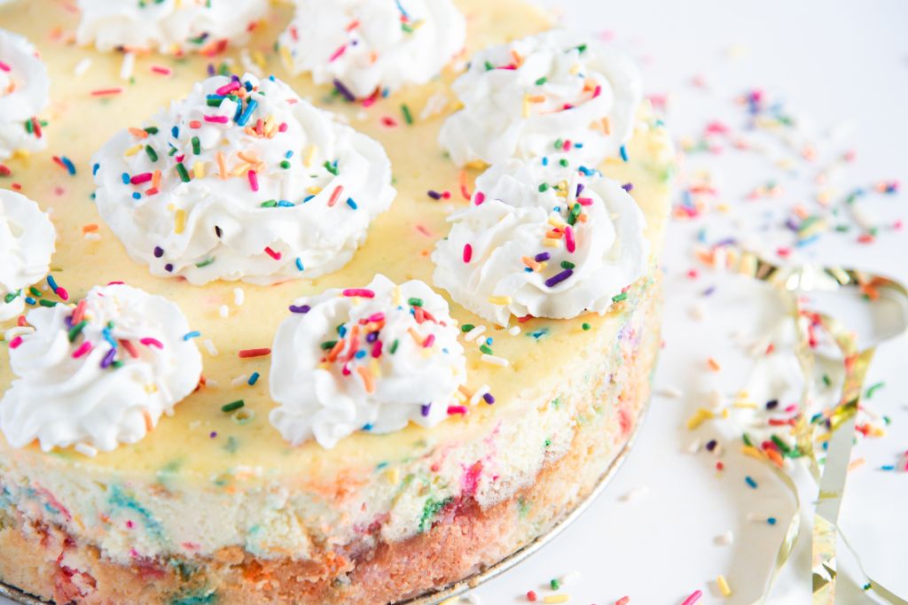 a cut off picture of birthday cake cheesecake