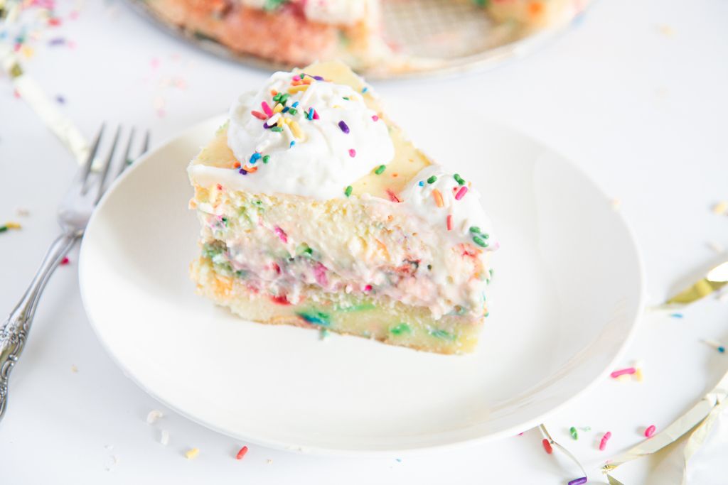 a piece of birthday cake cheesecake on a plate
