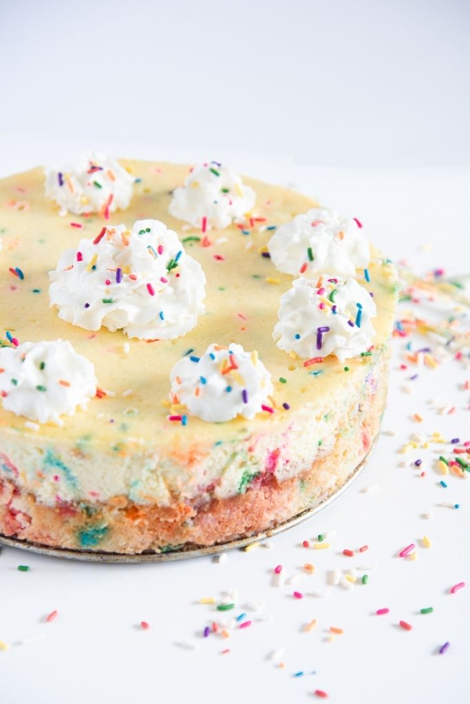 a cut off picture of finished birthday cake cheesecake