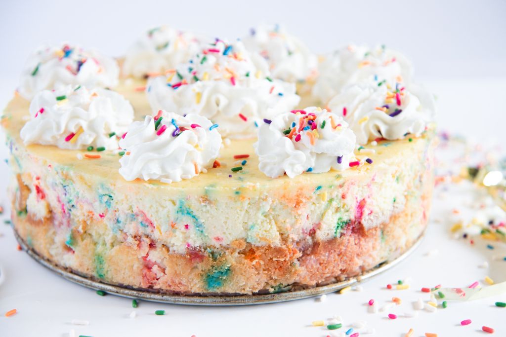 a side view of a birthday cake cheesecake