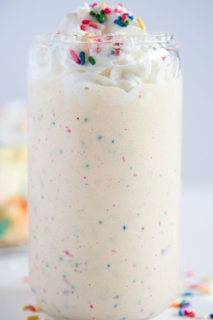 a close up of a birthday cake milkshake