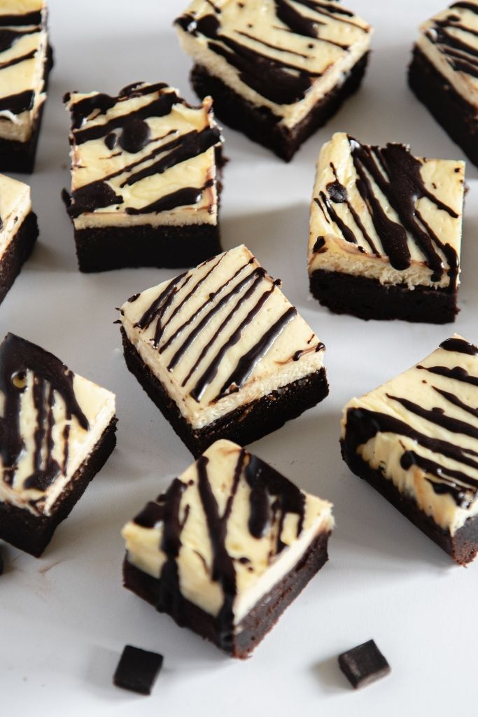 cheesecake brownies arranged on a table 