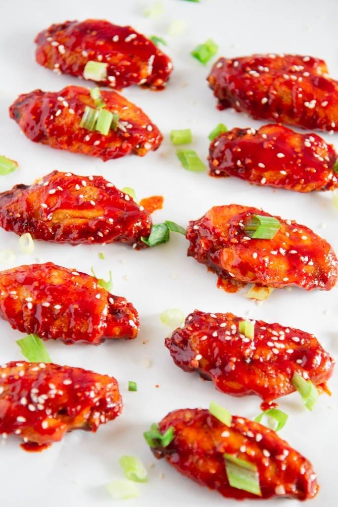 chicken wings lined up on the table 