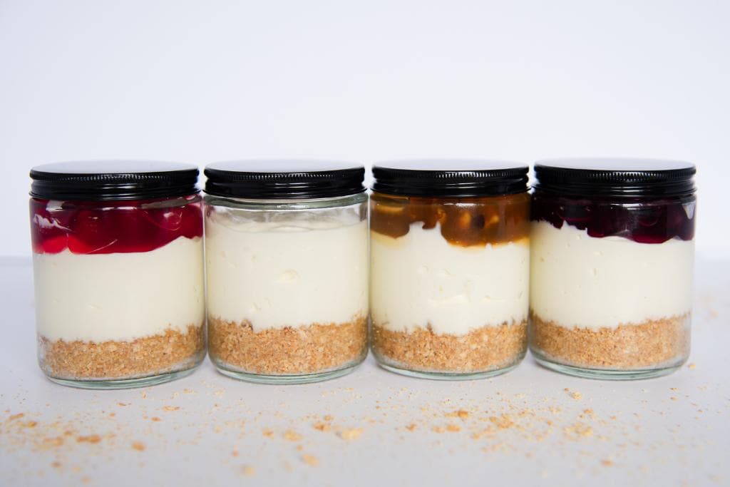 a four jars of no bake cheesecake lined up
