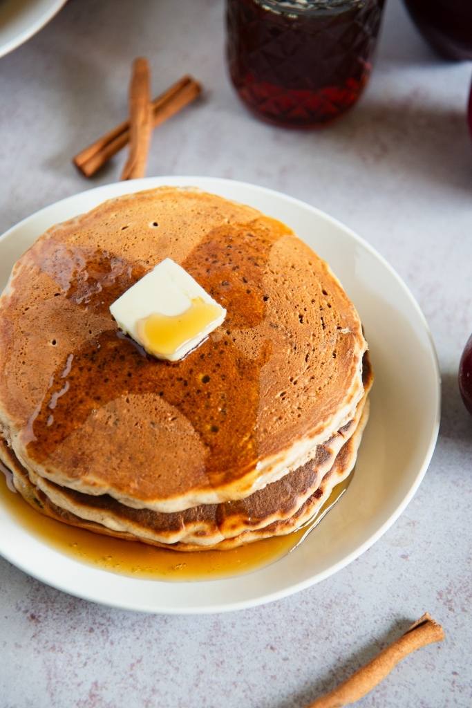 a stack of pancakes with butter and syrup on top 