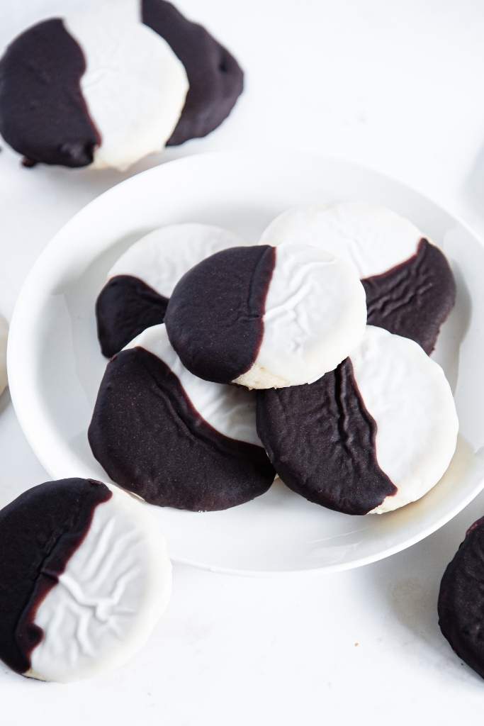 a plate of black and white cookies