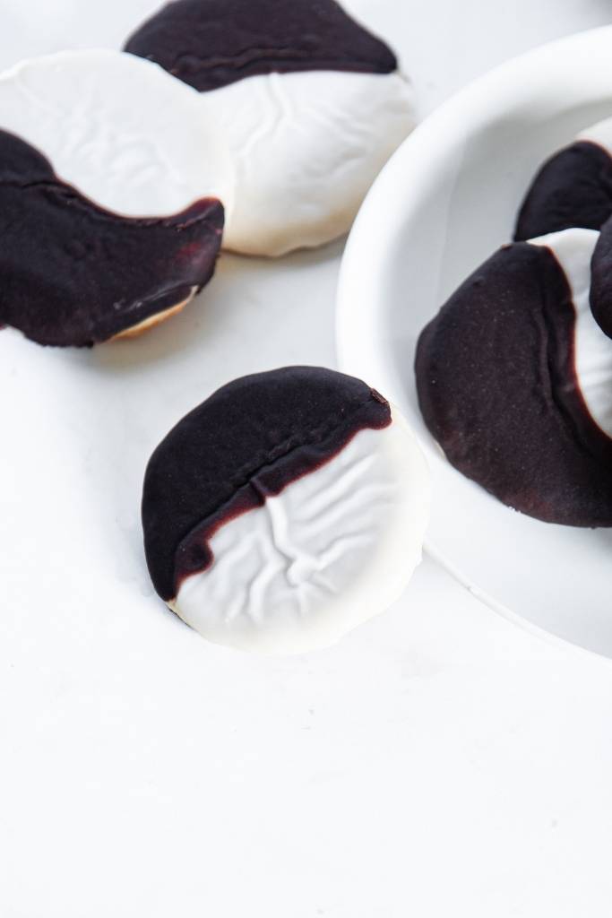 a cookie lined up against a plate of cookies