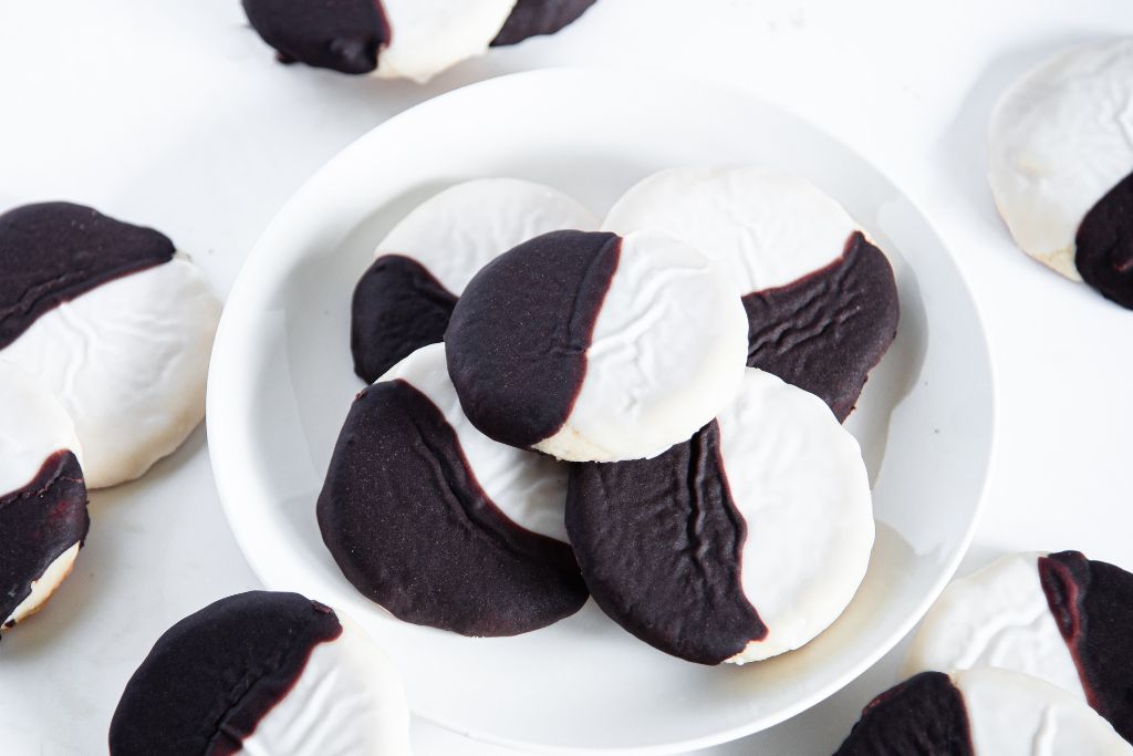 a plate of black and white cookies 