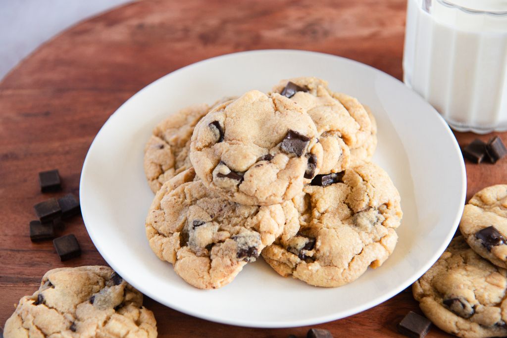 a plate of sourdough cookies, there some more cookies set next to the plate
