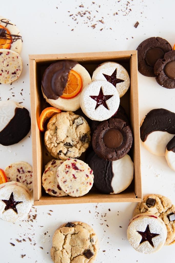 a finished cookie box with more cookies around it 