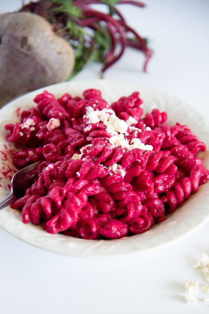 a close up of a bowl of pasta with a fork in it 