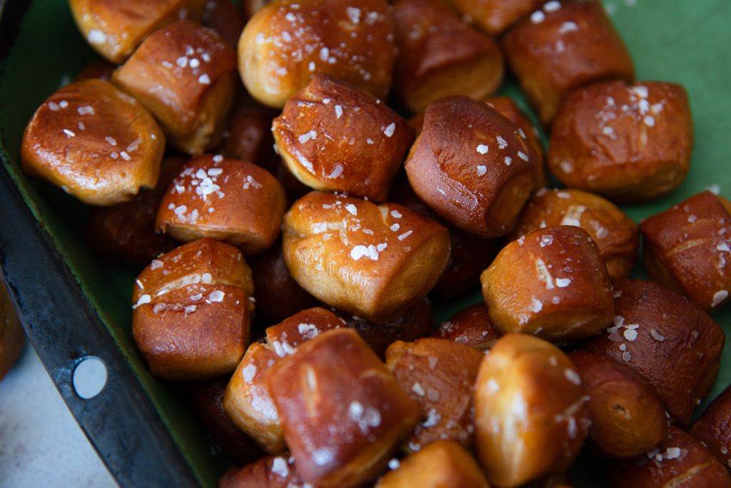 a close up of a dish full of pretzel bites