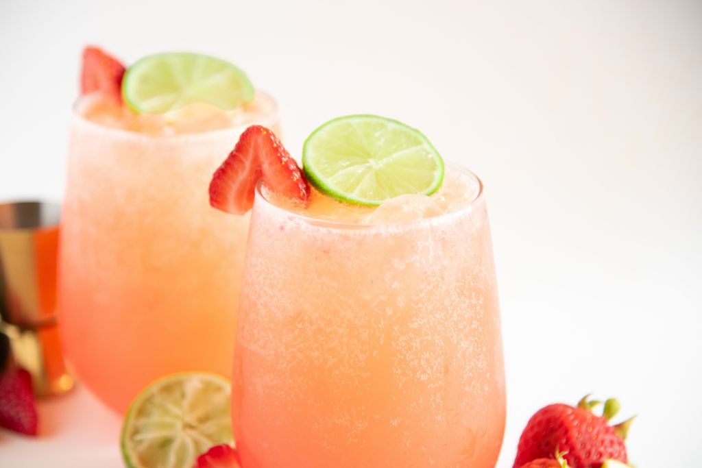 a close up of a strawberry mocktail, you can see another mocktail behind it