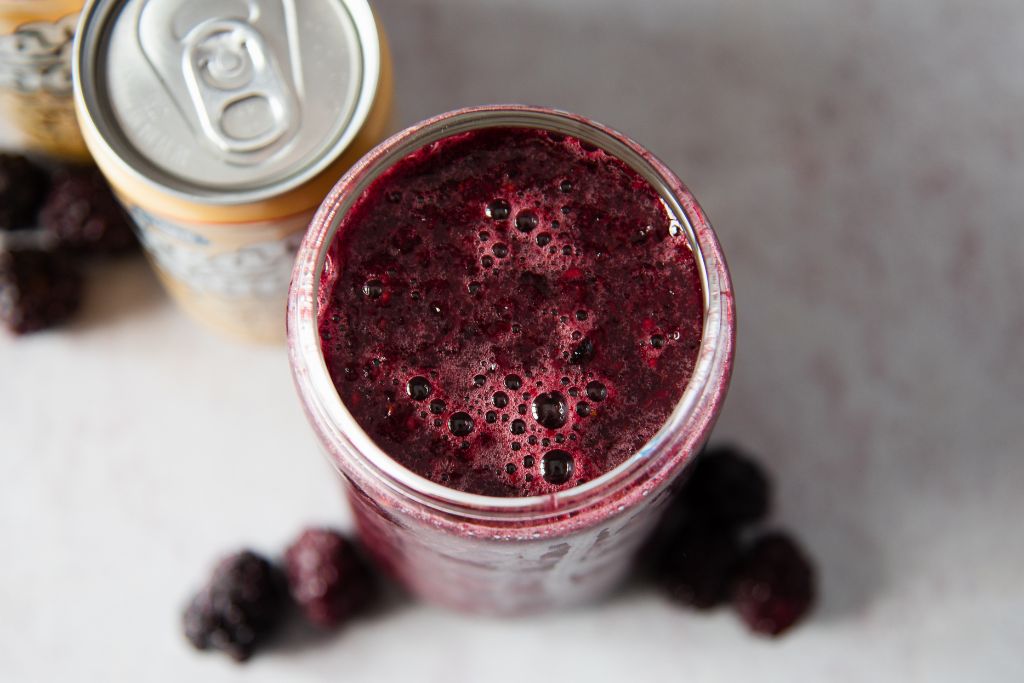 a close up of the top of a blackberry slushy 