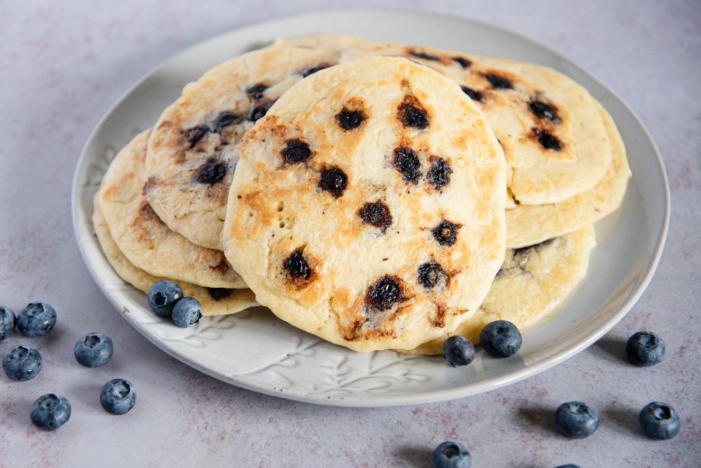 a plate of blueberry pancakes