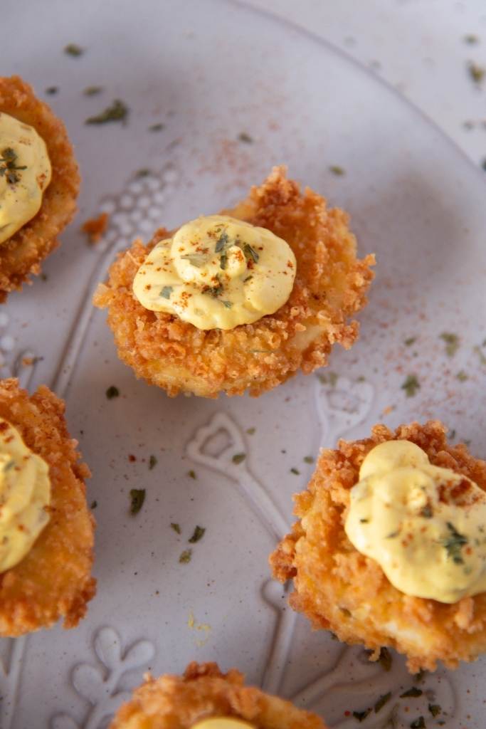 a cut off picture of a plate of a deviled eggs