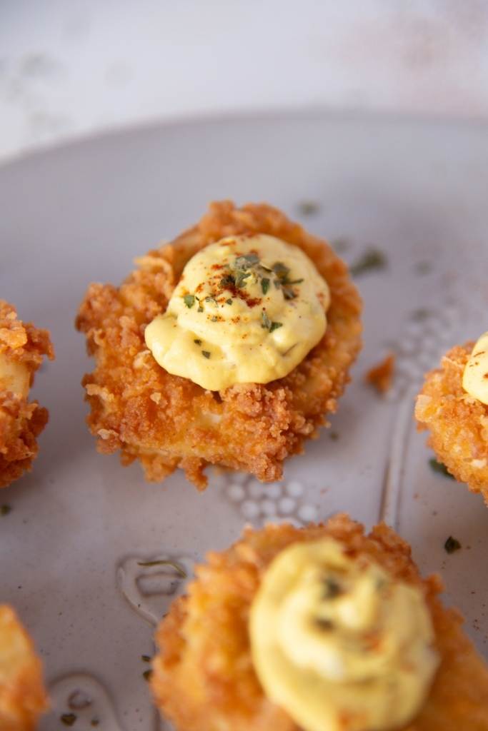 a close of a deep fried deviled egg