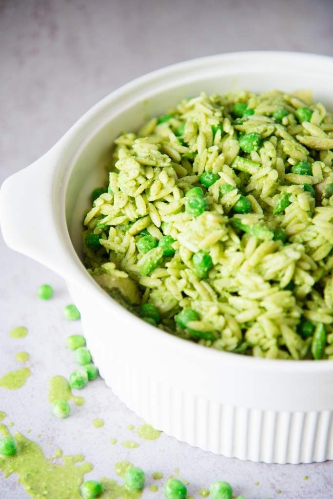 a close-up of a bowl of pasta salad, you can only see part of the bowl