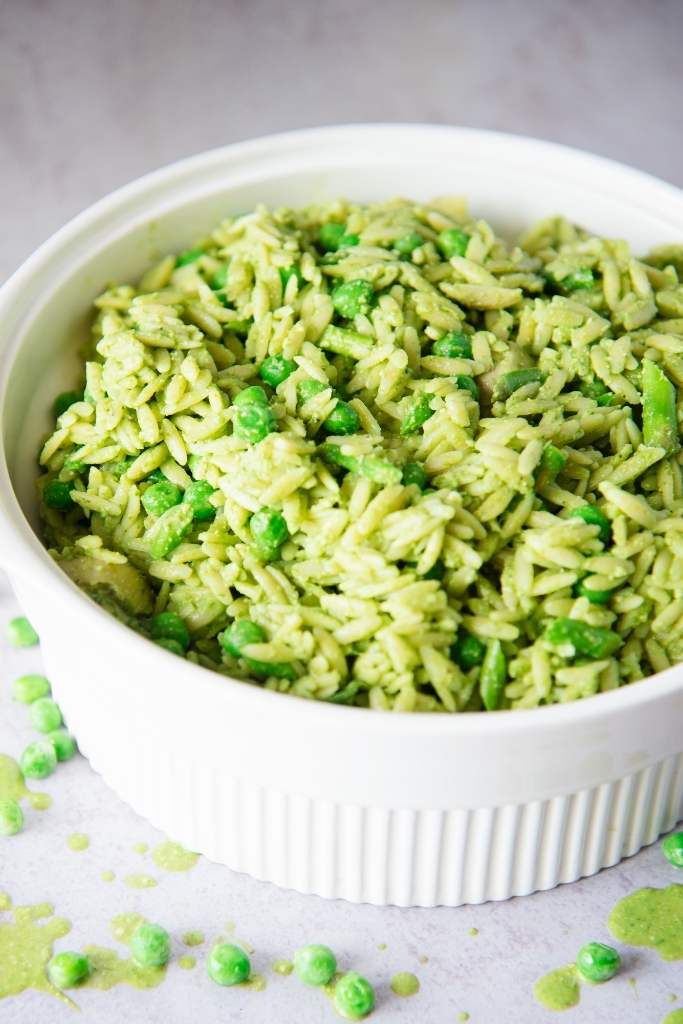 a white bowl of orzo pasta salad 