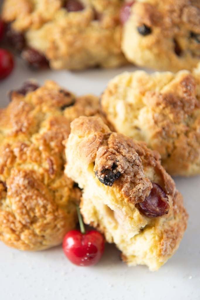 a close up of broken scone set against a another scone 
