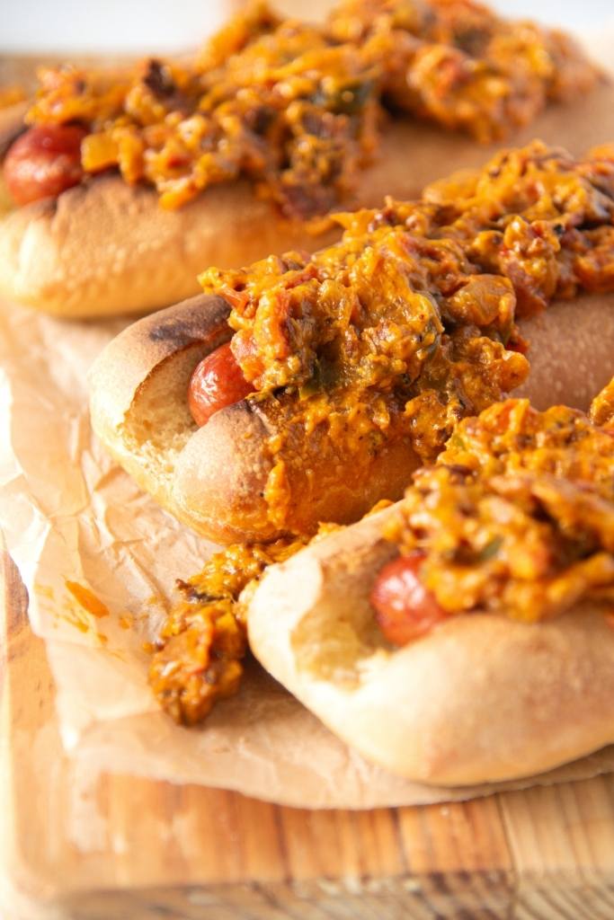 hot dogs on a wooden serving tray