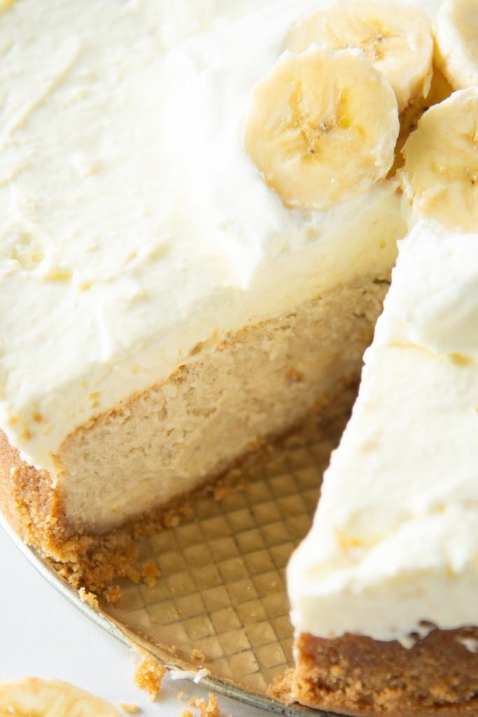 a close up of a cheesecake with a slice taken out of it 